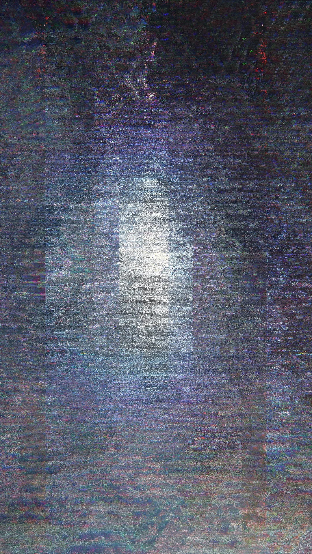 Vertical image of dense blue-grey digital noise with a brighter, blocky glowing shape in the centre